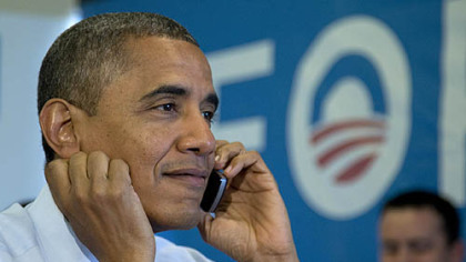 President Barack Obama calls Wisconsin volunteers as he visits a campaign office call center today.