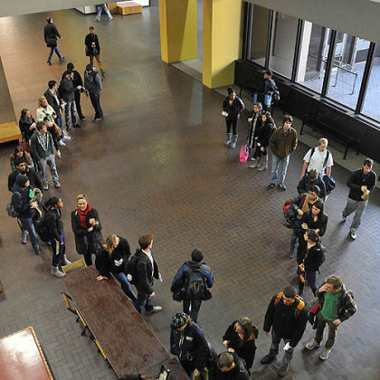 Students line up to vote today in Posvar Hall at the University of Pittsburgh.