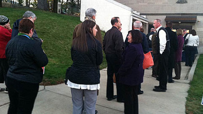 Voters stand in line at 7 a.m. to enter the poll at Christ Episcopal Church in Ross.