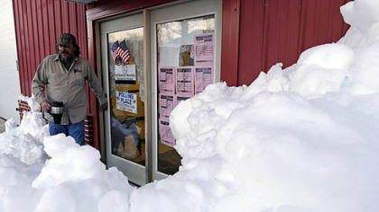 Not that far from Pittsburgh: Snow surrounds the polling precinct in Terra Alta, W.Va., as Peter Hough heads to work after casting his ballot.