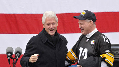 Former U..S. President Bill Clinton reacts after embracing  U.S. Rep. Mark Critz, who is running for re-election against Republican challenger Keith Rothfus.