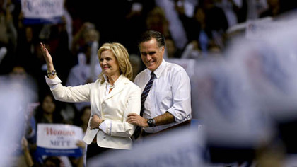 Republican presidential candidate, former Massachusetts Gov. Mitt Romney takes the stage with wife Ann before speaking at a campaign event at the Verizon Wireless Arena, in Manchester, N.H.