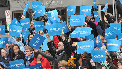 Supporters of President Obama stand in the Market Square crowd and wait  to hear former U.S. President Bill Clinton speak.