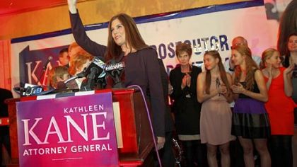Kathleen Kane smiles at the media after voting at a polling place Tuesday in the Waverly Community House, in Waverly, Pa.