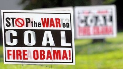 Signs in Waynesburg attack the president and his coal policies.