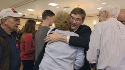 Republican Keith Rothfus, left, hugs a supporter Tuesday night at the Holiday Inn in Ross after winning his congressional seat.