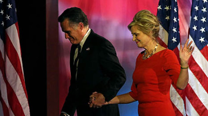 Republican presidential candidate Mitt Romney and his wife, Ann, walk off of the stage after conceding the presidency during Mitt Romney's election night event at the Boston Convention & Exhibition Center in Boston, Mass.