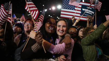 Supporters of President Barack Obama cheer after networks project Obama for re-election during the Obama Election Night watch party at McCormick Place in Chicago, Illinois.