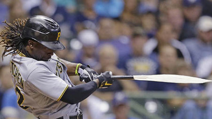 Andrew McCutchen breaks his bat during his RBI single against the Milwaukee Brewers.