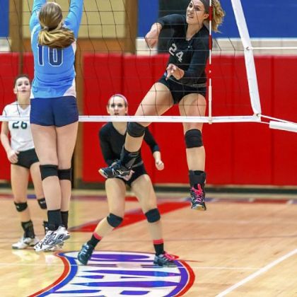 Greensburg Central Catholic's Shannon Hurley slams a shot as Bishop Canevin's Bailey McDonald goes for the block in the WPIAL Class A championship match.