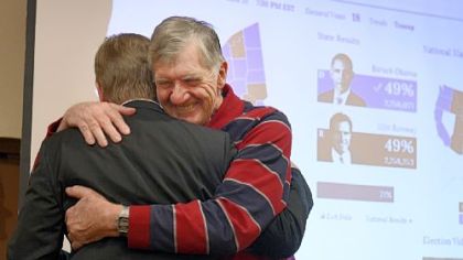 Republican Keith Rothfus, left, hugs his father, Earl, Tuesday night at the Holiday Inn in Ross after winning a congressional seat.