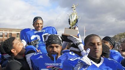 Perry players celebrate by hoisting Cornelio Coates on their shoulders after he made the winning field goal in the City League championship against University Prep Saturday at Cupples Stadium.