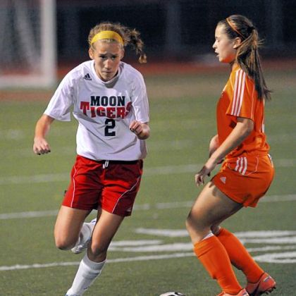 Moon Area's Michaela Guttierrez tries to maneuver around Yough's Mikayla Mance during a WPIAL quarterfinal match.