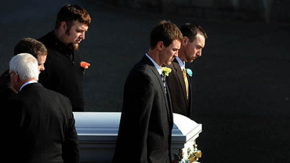 Pallbearers carry the casket of Maddox Derkosh, the 2-year-old who died after falling into the African painted dog exhibit at the Pittsburgh Zoo, into St. Bernard Church in Mt. Lebanon this morning.