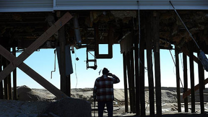Dave Davis of Bethlehem, Pa., visits his home in Holgate on Long Beach Island, NJ, for the first time since superstorm  Sandy stuck the region.