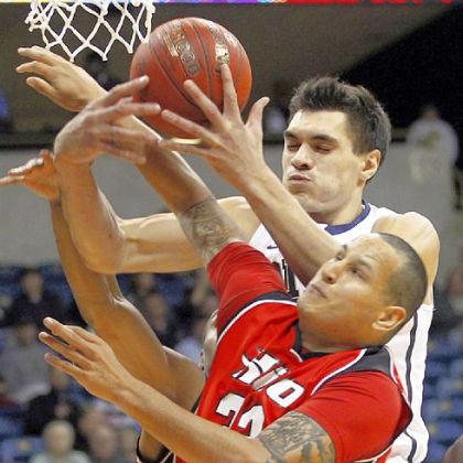 Pitt freshman Steven Adams, top, and Hawaii Hilo's Kiel Myers battle for a rebound in the first half last Friday at the Petersen Events Center.