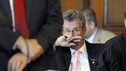 Joe King, president of the Pittsburgh firefighters union, listens to a hearing before the state Department of Community & Economic Development on removing the city from Act 47 and its designation as a financially distressed municipality. The hearing was held in city council chambers.