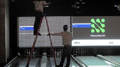 Construction workers install equipment in the bowling lanes at Latitude 40 in North Fayette.