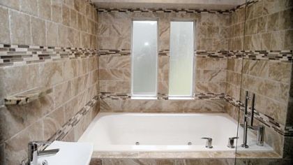 The centerpiece of Richard Wizig's bathroom is one long tiled room with what he calls "the world's most expensive tub."