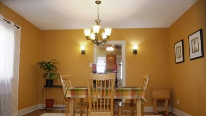 The dining room at the Brookline home, with an entry to the kitchen.