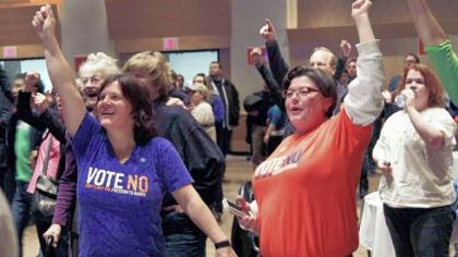 Kristi Otterson, right, and Gretchen Rules celebrate early returns in St. Paul, Minn., as they joined the Election Night gathering of Minnesotans United for All Families who opposed a proposed state constitutional amendment to ban gay marriages.