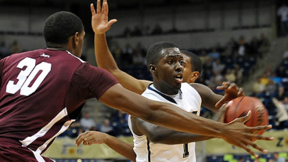 Tray Woodall looks for an open teammate during the first half of the NIT season tip off tournament Monday night against Fordham.