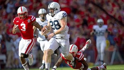 Penn State's Zach Zwinak (28) breaks free from Nebraska defenders Saturday in Lincoln, Neb.
