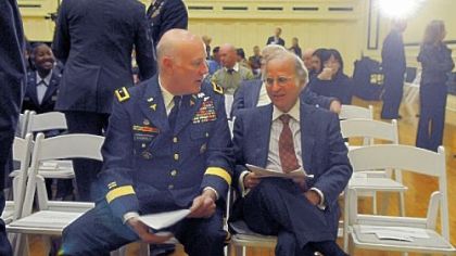 Army Brig. Gen. W. Bryan Gamble, deputy director of TRICARE Management Activity, talks with Arthur Levine, University of Pittsburgh School of Medicine dean, Friday during a symposium on military medical research at Soldiers & Sailors Memorial Hall & Museum in Oakland.