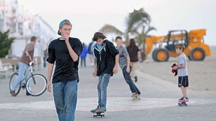 Skateboarders make their ways Sunday along the boardwalk in Ocean City, Md., as beach restoration continues after Superstorm Sandy.