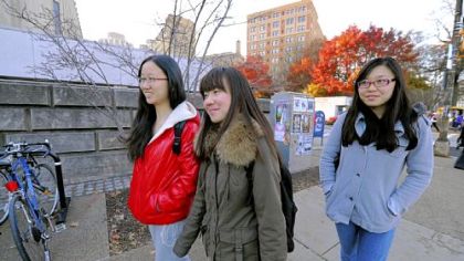 International students Ellen Hu, 23, Maggie Lin, 23, and Lauren Su, 20, right, walk to class at the University of Pittsburgh.