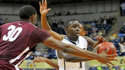 Tray Woodall (1) looks for an open teammate during the first half of a Preseaon NIT game against Fordham Monday night at Petersen Events Center.