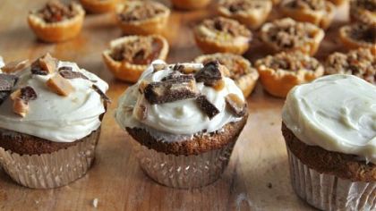 Pumpkin Spice Cupcakes with Maple Frosting and, in back, Mini Pumpkin-Maple Tarts with Toasted Pecan Streusel.