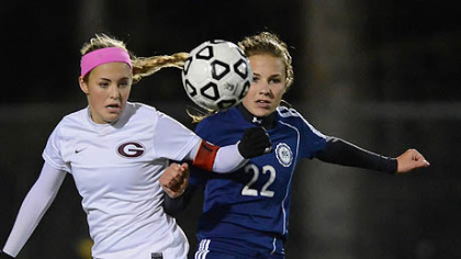 Shady Side Academy Tori Winter heads ball past Greensburg Central Catholic's Malea Fabean.