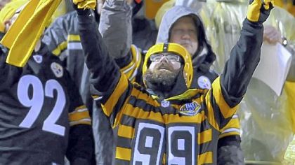 IMPLORING THE GODS? A Steelers fan who braved the elements Monday night at Heinz Field does his best to will the team to victory. The Steelers went to 6-3 with a 16-13 overtime victory against Kansas City.
