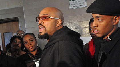 Latonya Green, left, , mother of Leon Ford, who was shot by Pittsburgh Police during a traffic stop November 11, 2012, listens to Leon's father, Leon Ford, Sr.  during a press conference at which the family called upon the city and the police to allow them to see him in the hospital. At right is Leon's older brother, Mondale Ford.