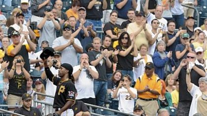 Pirates fans give center fielder Andrew McCutchen a standing ovation as he makes his way to the PNC Park dugout during the team's season finale against Atlanta in October.