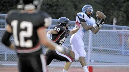 Woodland Hills' Tom Greene caught a touchdown pass against Upper St. Clair in the season opener.