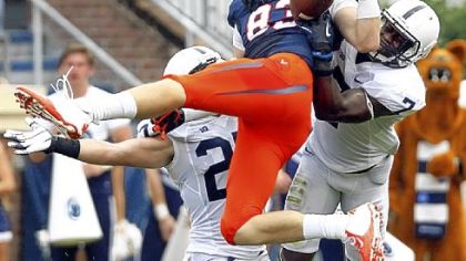 Safety Stephen Obeng-Agyapong, right, comes up to defend Virginia's Jake McGee earlier this season.
