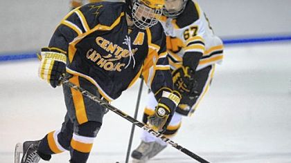 Central Catholic's Chris McCambridge carries the puck up ice against North Allegheny during the Vikings' season opener.