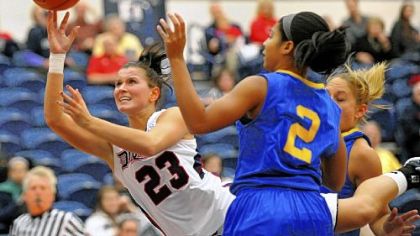 Duquesne's Belma Nurkic slips through the Delaware defense for a shot in the first half Wednesday night at Palumbo Center.