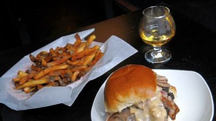 Winghart's 'Oly Cah! burger, which is topped with grilled chipped-chopped ham and beer cheese, served here with fries and a neat Aberlour A'bunadh single-malt Scotch whisky.