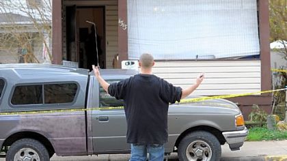 A man who would identify himself only as a relative of one of the residents of 1513 Broadway Ave., Stowe, arrives there Wednesday.  Earlier, the body of Elizabeth Cannon, 21, was found inside, along with her unconscious boyfriend, Andrew Sheets, 25, who was hospitalized.