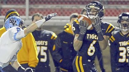 North Allegheny's Elijah Zeise pulls in a pass for a touchdown as he's defended by Seneca Valley's Jordan Brown Friday night.