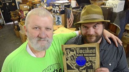 Jerry Weber, left, of Jerry Records in Squirrel Hill, and his son, Willie, hold a rare copy of Robert Johnson's "I Believe I'll Dust My Broom" on the Vocalion label. The "holy grail of 78s" is estimated to be worth $6,000 to $12,000.