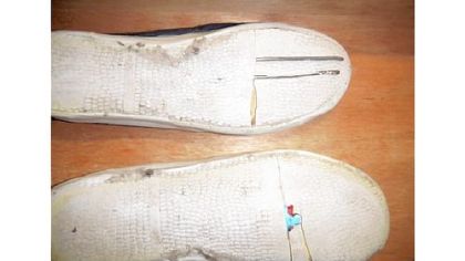 This photo from the Allegheny County district attorney's office show shivs Ronald Robinson had in his jail shoes.