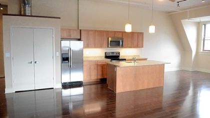 Most of the first- and fourth-floor units have 16-foot ceilings. The kitchens feature stainless-steel Whirlpool appliances, two choices of granite countertops and Jim Bishop maple cabinets in three shades of stain.