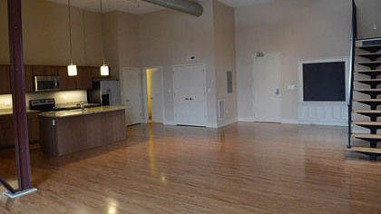 Most of the first- and fourth-floor units have 16-foot ceilings. The kitchens feature stainless-steel Whirlpool appliances, two choices of granite countertops and Jim Bishop maple cabinets in three shades of stain.