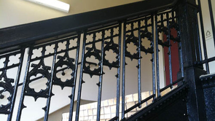 Cast-iron balustrade on a set of stairs in the lofts.