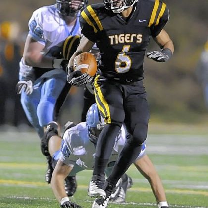 North Allegheny's Elijah Zeise carries against Seneca Valley Friday.