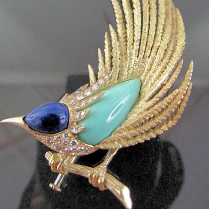 Roadrunner pin, fashioned in France, is made of 14-karat gold, diamonds, lapis and turquoise. Estimated sale price is between $1,500 and $3,000. It is from the estate of Amelia Neville Shields Guirola to be auctioned at Concept Gallery.